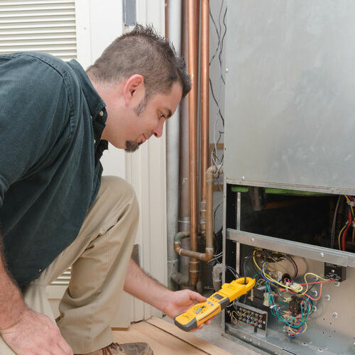 Technician Working on HVAC Service